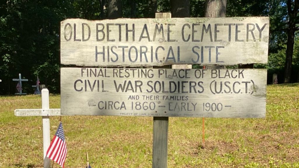 A sign marks the Squirrel Town cemetery, where an estimated 35 black Civil War veterans rest in peace. (George Willis)