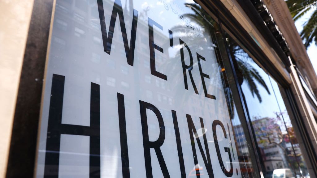 A 'We're Hiring!' sign is displayed at a Starbucks on June 23, 2021, in Los Angeles, California. The U.S. Bureau of Labor Statistics reported that 850,000 jobs were added to the economy in June. (Mario Tama/Getty Images)