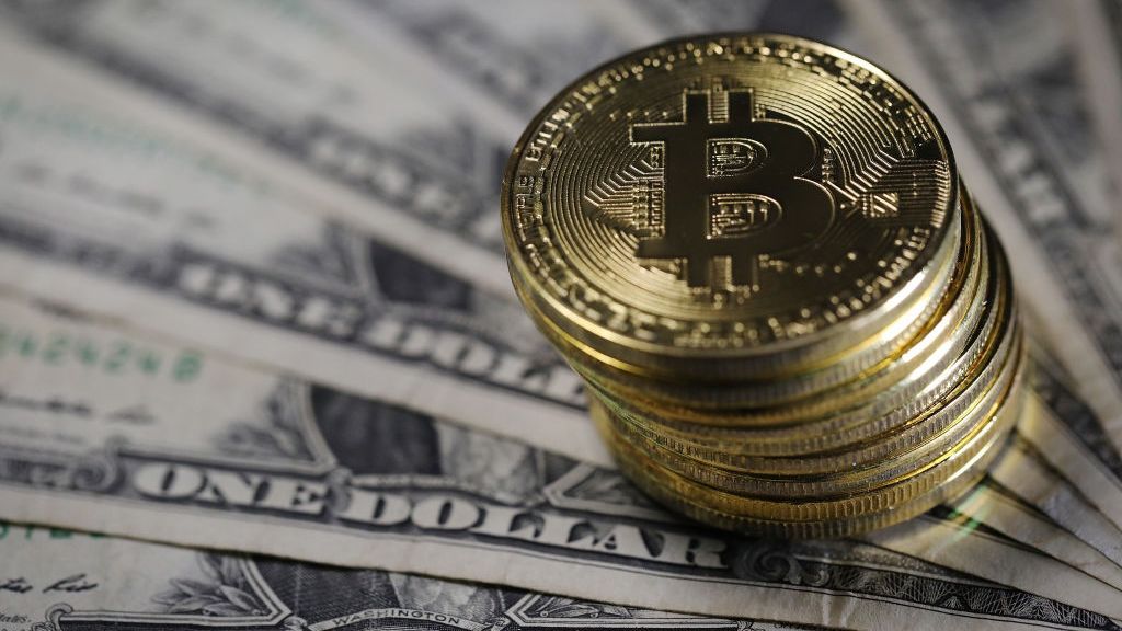Under accounting rules, cryptocurrencies are considered intangible assets. A company records the value on its balance sheet at acquisition. But should there be an impairment—like a significant drop in value—the losses are written down on the balance sheet. (Photo by Dan Kitwood/Getty Images)