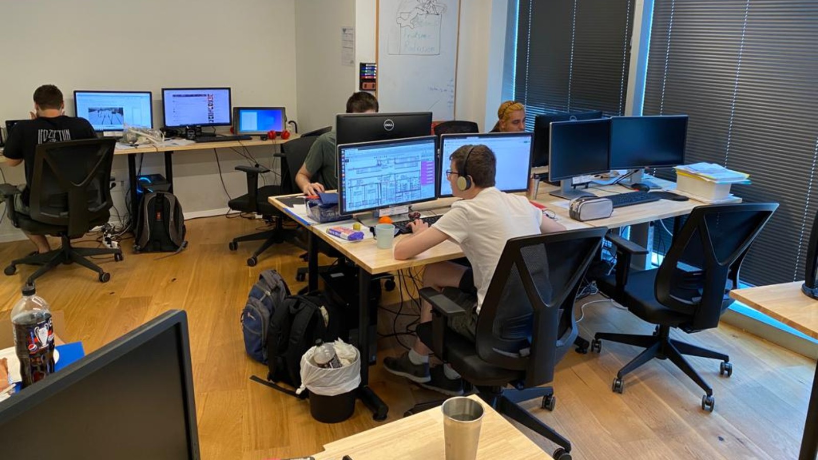 Employees of Point.AI at their workstations. All work in data annotation. (Courtesy of Point.AI)
