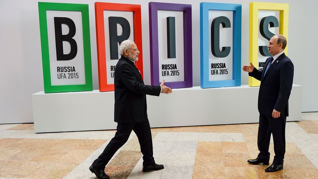 President Vladimir Putin (R) and Prime Minister Narendra Modi attend the welcome ceremony for the BRICS leaders during the BRICS/SCO Summits - Russia 2015, in Ufa, Russia. (Host Photo Agency/Ria Novosti/Getty Images)