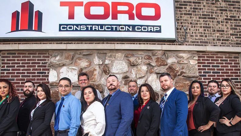 Luis Vázquez, his wife Socorro, his brother Carlos and the rest of Toro Construction Corp. (Courtesy of Toro Construction Corp.)