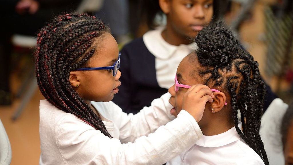Girls were among the elementary school groups with the biggest gains in reading and math test scores after receiving eyewear through the Vision for Baltimore program, according to findings in a Johns Hopkins University study. (Will Kirk/Johns Hopkins University)