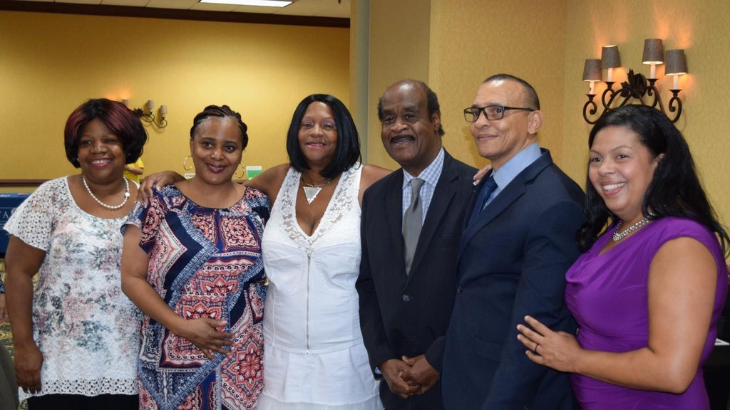 Larry Simmons (second from right) with Women Who Care Ministries board members (from left) Lorna Green, Shannon Matthews, Judith Clarke, Montgomery County Executive Isiah Leggett and Victoria Nobles. “[Simmons'] commitment to helping others overcome challenging areas of their lives is unparalleled,” said Executive Director Clarke. (Courtesy of Larry Simmons)
