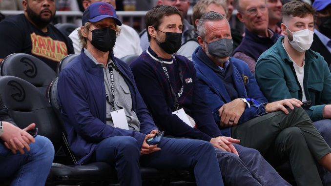 Actors and brothers Owen Wilson and Luke Wilson wear masks as they watch the Atlanta Hawks face the Houston Rockets at State Farm Arena on Dec. 13, 2021, in Atlanta, Georgia. (Kevin C. Cox/Getty Images)