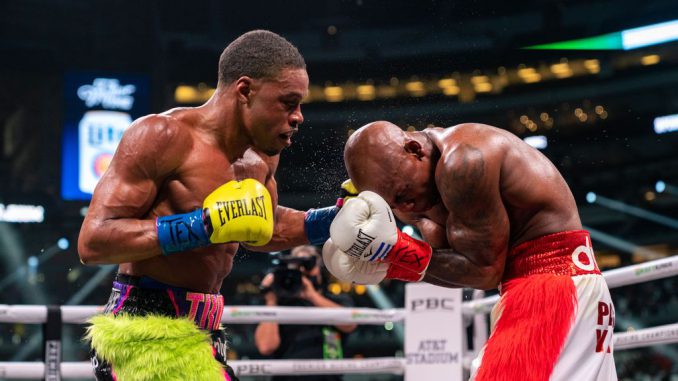 Errol Spence (left) repeatedly used his left uppercut on the right eye of Yordenis Ugas (right) on the way to a 10th-round knockout on Saturday, which added the Cuban's WBA 147-pound title to Spence's IBF and WBC versions. (Ryan Hafey/Premier Boxing Champions)