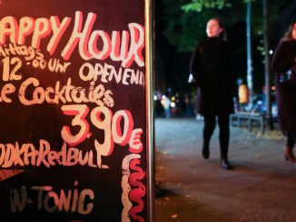 A sign advertises all-day Happy Hour cocktails for sale at a bar prior to its closing at 11pm on October 17, 2020 in Berlin, Germany. (Photo by Adam Berry/Getty Images)