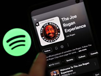 In this photo illustration, The Joe Rogan Experience podcast is viewed on Spotify's mobile app on January 31, 2022 in New York City. (Photo Illustration by Cindy Ord/Getty Images)