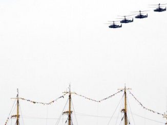 Russian Kamov Ka-52 Alligator attack helicopters fly above the masts of a tall ship in the Crimean port of Sevastopol on May 9, 2014. Helicopters have been a key asset for both Ukraine and Russia in the latest conflict between the two countries.  YURI KADOBN/AFP VIA GETTY IMAGES