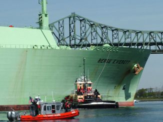 FILE - A U.S. Coast Guard boat helps the Liquified Natural Gas container ship Berge Everett as it comes inbound May 8, 2006 in Boston, Massachusetts. (Photo by Kelly Turner/U.S. Coast Guard via Getty Images)