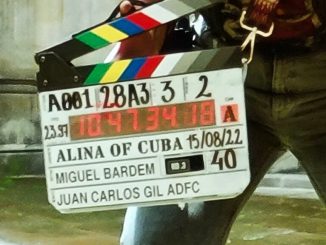Crew member holding a movie clapboard on the set of Alina de Cuba.  John Martinez O'Felan spoke to LatinHeat in regard to Latino representation. MANKIND ENTERTAINMENT/LATINHEAT