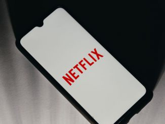 In this photo illustration a Netflix logo is displayed on a smartphone screen in Athens, Greece on January 18, 2023. Shareholders are hoping the streamer sheds light on the new plan during its fourth-quarter earnings report, which is due after the bell Thursday. NIKOLAS KOKOVLIS/BENZINGA