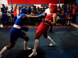 Cuban boxers fight during the first official women's boxing program in Cuba at the Giraldo Cordova boxing school in Havana, on December 17, 2022.  Cuban female boxer now can officially punch in the boxing ring after Cuban authorities allow women to compete in boxing. YAMIL LAGE/AFP via GETTYIMAGES