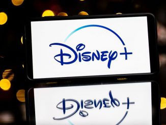 In this photo illustration a Disney + logo seen displayed on a smartphone. The Walt Disney Company had canceled all COVID-19 policies for the company in the company. SOPA IMAGES/BENZINGA