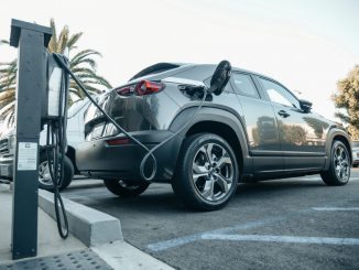 An electric car parked at a charging station. (Photo by Kindel Media via Pexels)