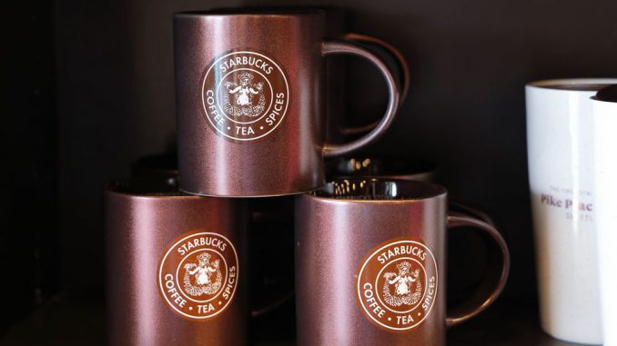 Cups are seen at a Starbucks store on March 19, 2023, in Seattle, Washington. Laxman Narasimhan takes over as CEO as a crucial time in clash with the unions. I RYU/BENZINGA