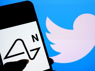 In this photo illustration, a Neuralink logo is seen displayed on a smartphone with a Twitter logo in the background. AVISHEK DAS/GETTY IMAGES