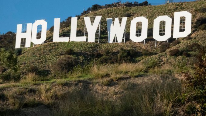 Hollywood's sign in Los Angeles, California. Cirews have told stories of some Hollywood productions demanding that they work more than the normal 12-hour shooting day, without getting paid for the extra hours worked. PAUL ROVERE/ GETTY IMAGES/i