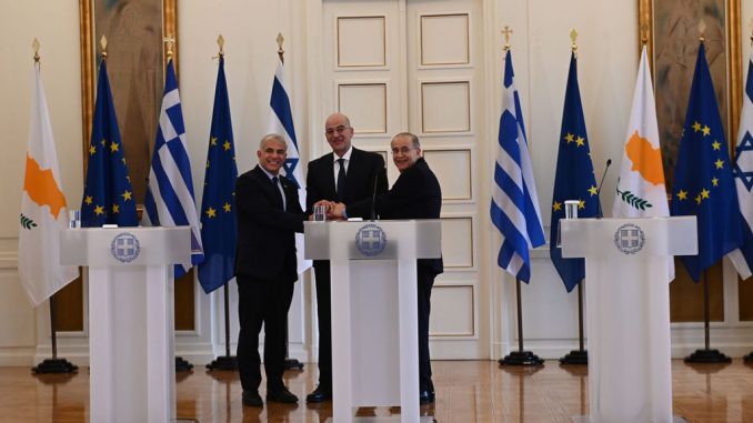 Former Israel Foreign Affairs Minister Yair Lapid (left), former Greek Foreign Affairs Minister Nikos Dendias (center), and Former Cyprus Foreign Affairs Minister Ioannis Kasoulides (right) in 2022. A summit for the leaders of Greece, Cyprus, and Israel will take place soon to finalize energy cooperation between the eastern Mediterranean allies. DIMITRIOS KARVOUNTZIS/PACIFIC PRESS/LIGHTROCKET VIA GETTY IMAGES