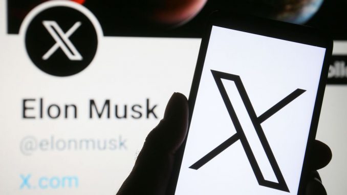 In this photo illustration, the new Twitter logo rebranded as X (X Corp.) is seen on a smartphone and Elon Musk Twitter account with the new X logo on a pc screen. (PAVLO GONCHAR/GETTY IMAGES)