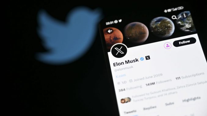 ANKARA, TURKIYE - JULY 24: In this photo illustration, Twitter account of Elon Musk is displayed in front of a screen displaying the former logo of 'Twitter' in Ankara, Turkiye on July 24, 2023. PHOTO BY HARUN OZLAP/GETTY IMAGES