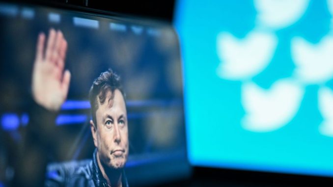 ANKARA, TURKIYE - JULY 02: In this photo illustration, Elon Musk's photo is displayed on a phone screen with logo of 'Twitter' in the background on a computer screen in Ankara, Turkiye on July 02, 2023. a href=https://www.Zenger News.com/news/23/05/32378391/twitters-new-ceo-once-tried-to-convince-elon-musk-to-stop-tweeting-after-3-a-mstrongElon Musk/strong outlined a new measure by strongTwitter/strong/astrong /strongto tackle extreme levels of data scraping and system manipulation from the platform. PHOTO BY OSMANCAN GURDOGAN/GETTY IMAGES(Photo by Osmancan Gurdogan/Anadolu Agency via Getty Images)