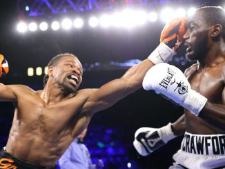 Two-time champion Shawn Porter (left) announced his retirement following Saturday's two-knockdown 10th-round TKO loss to three-division and WBO champion Terence Crawford (right), who remained unbeaten with his ninth straight knockout victory. (Mikey Williams/Top Rank Via Getty Images)