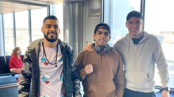 Hugo “The Hooligan” Flores (left), Enrique “Baby Bull” Gonzalez and Ignacio “La Jaula” Bahamondes prepare to leave Chicago for tonight's Combate Global eight-man tournament in Miami. (Enrique Gonzalez Facebook)