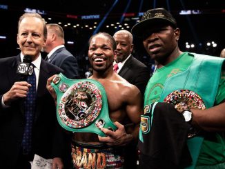 Two-time champion Shawn Porter (center) credits father and trainer Kenny (right) for their mutual resilience heading into Saturday's clash with undefeated three-division and WBO welterweight titleholder Terence Crawford. (Amanda Westscott/Showtime)