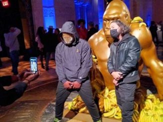 The “First Congress of The Sapien Tribe” gala and charity event was held during the recent NFT NYC tech conference.  Among the items on-site was the NFT (non-fungible token) of the Harambe statue on Wall Street that attendees are shown posing with here. (Lisa Chau)