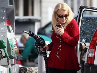 Analysts say drivers are beginning to pay slightly less at the pump, a trend they think will continue. (Justin Sullivan/Getty Images)