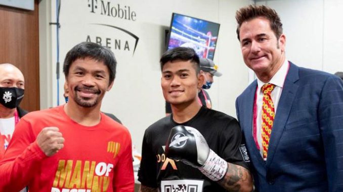 Unbeaten Mark Magsayo (center) fights WBC 126-pound champion Gary Russell Jr. on Saturday, 27 years to the day from the professional debut of Filipino countryman and eight-division champion Manny Pacquiao (left). MP Promotions President Sean Gibbons is at right. (Francis Magsayo)