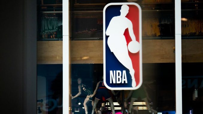 Under the NBA's updated health and safety protocols for COVID-19, players who are vaccinated and asymptomatic can return to action five days after a positive COVID-19 test as long as their cycle-threshold level is above 30. (Jeenah Moon/Getty Images)
