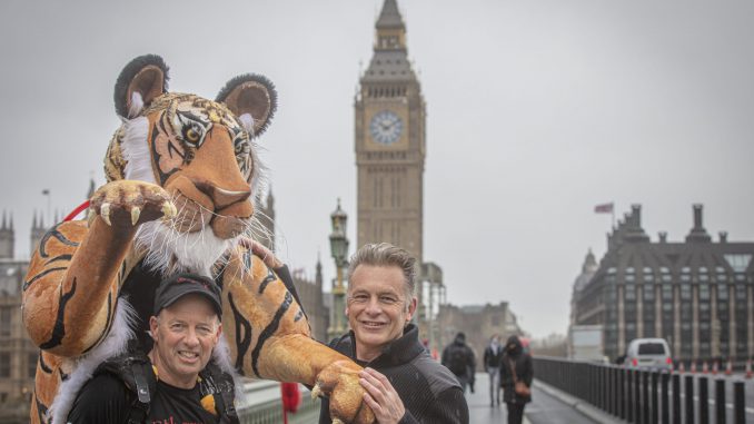 A wildlife photographer plans to run the Everest marathon this month – in a TIGER suit. (Paul Goldstein/Zenger)
