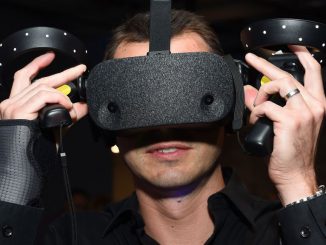 A guest wears a virtual reality (VR) headset at a Film Independent event in September 2019 in Playa Vista, California. VR enthusiasts can perform everyday tasks such as shopping, working or networking with a new app from Gravvity. (Amanda Edwards/Getty Images)