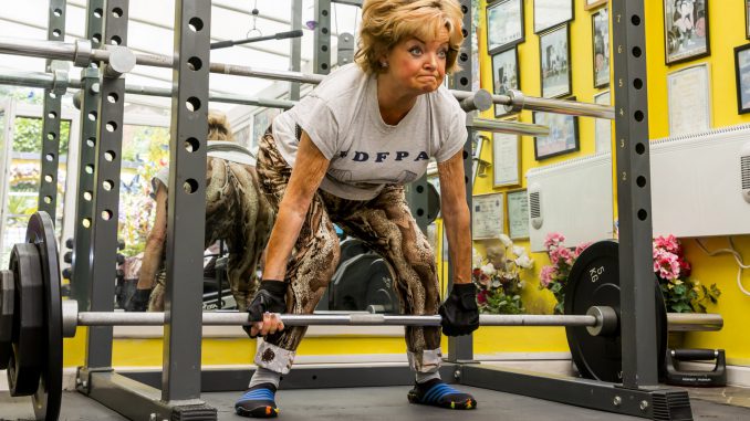 Britain's toughest gran cheated death three times to become a champion powerlifter and is still pumping iron at the age of 76. (Simon Galloway/Zenger)
