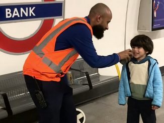 London Underground worker lets a train-obsessed toddler announce an incoming train. (Ifat Sementilli/Zenger)