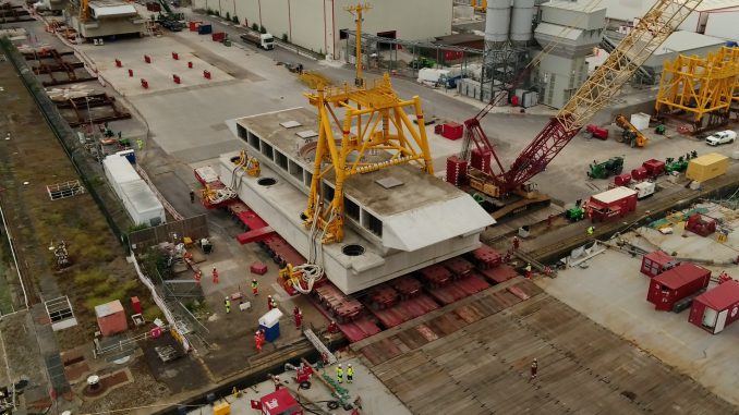 A floating crane has arrived at Hinkley Point C nuclear power station to lower its new water-cooling system into place on the seabed. (Dean Murray, SWSN/Zenger)