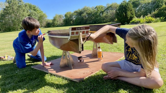 Young brothers Ollie and Harry Ferguson pose in this undated photograph while building their replicas of the Erebus and the Terror. (Matthew Newby, SWNS/Zenger)