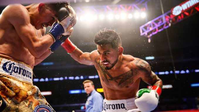 Abner Mares attempts to penetrate the guard of Leo Santa Cruz during their 2018 rematch. (Stephanie Trapp/Showtime) 