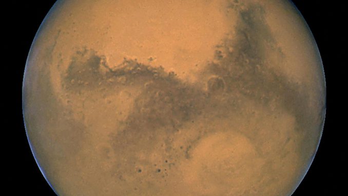 This image released August 27, 2003 captured by NASA's Hubble Space Telescope shows a close-up of the red planet Mars when it was just 34,648,840 miles (55,760,220 km) away. Carbon dioxide is already being converted into oxygen on Mars thanks to an invention undergoing testing that could lead to the colonization of the red planet.  (Photo by NASA/Getty Images)