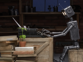 A robot can be seen using a typewriter. The advancement of AI-based writing products is creating paranoia among writers as they fear that a creation of such kind might sabotage their chances of employment. (Image by Vasilyev Alexandr via Shutterstock)