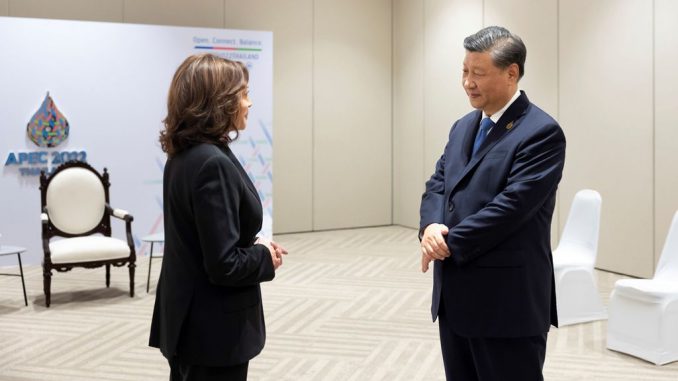 Chinese President Xi Jinping has a brief exchange with U.S. Vice President Kamala Harris at the latter's request on the sidelines of the 29th Asia-Pacific Economic Cooperation APEC Economic Leaders' Meeting in Bangkok, Thailand, Nov. 19, 2022. DING HAITAO/XINHUA VIA GETTY IMAGES 