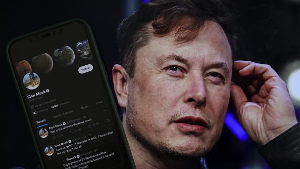 Elon Musk's Twitter profile is on a mobile phone and his image is on a computer screen on back of it in Ankara, Turkiye, on October 06, 2022. 180 organizations have urged Twitter to adopt the IHRA definition of antisemitism. MUHAMMED SELIM KORKUTATA/ANADOLU AGENCY VIA GETTY IMAGES