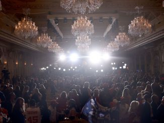 Supporters watch as former U.S. President Donald Trump exits after he spoke during an event at his Mar-a-Lago home on November 15, 2022, in Palm Beach, Florida. Trump announced that he was seeking another term in office and officially launched his 2024 presidential campaign. The former president made an announcement of his NFT that was released for $99. JOE RAEDLE/BENZINGA