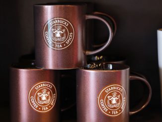Cups are seen at a Starbucks store on March 19, 2023, in Seattle, Washington. Laxman Narasimhan takes over as CEO as a crucial time in clash with the unions. I RYU/BENZINGA