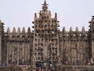 strongPeople take part in the annual rendering of the Great Mosque of Djenne in central Mali on April. 28, 2019. MICHELE CATTANI/AFP/GETTY IMAGES/strong
