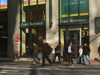 People walk across 10th Avenue in front of a First Republic Bank branch on March 20, 2023, in New York City. Eleven on the big banks deposited $30 billion to restore the trust of the banking system of First Republic Bank. GARY HERSHORN/BENZINGA