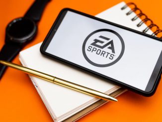 In this photo illustration a EA Sports logo seen displayed on a smartphone. EA's previous Star Wars game sold 8 million units in just a month and a half and 10 million units in four and a half months.  MATEUSZ SLODKOWSKI/BENZINGA
