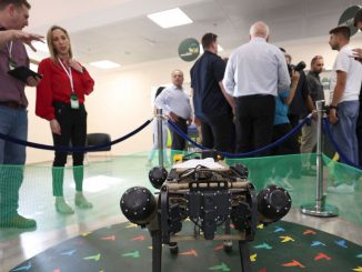An autonomous robotic dog used in civilian and military operations, produced by the Israeli defence contractor Rafael, is presented at an exhibition at the Galilee Conference in Israel's northern city of Migdal HaEmek on September 13, 2022. Israel's aim is to become a powerhouse in the field of Artificial Intelligence, Maj. Gen. (res.) Eyal Zamir, director general of the Defense Ministry, said at the 2023 Herzliya Conference on Monday. PHOTO BY JALAA MAREY/GETTY IMAGES